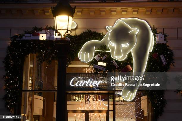 General view of the illuminated Cartier store on the Champs Elysees avenue for Christmas and New Year celebrations on November 30, 2020 in Paris,...