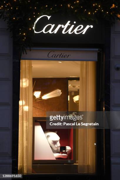 Detail view of the illuminated Cartier store on the Champs Elysees avenue for Christmas and New Year celebrations on November 30, 2020 in Paris,...