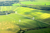 Aerial view of green field, position point and boundary line to show location and area. A tract of land for owned, sale, development, rent, buy or investment.