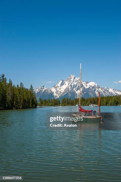 Sailboat in Colter Bay on Jackson Lake in the Grand Teton National Park, Wyoming, United States.