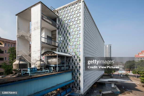 Oblique view of east elevation from northeast showing coffin shaped concrete panels and concrete access stairs on east elevation and spectacular...