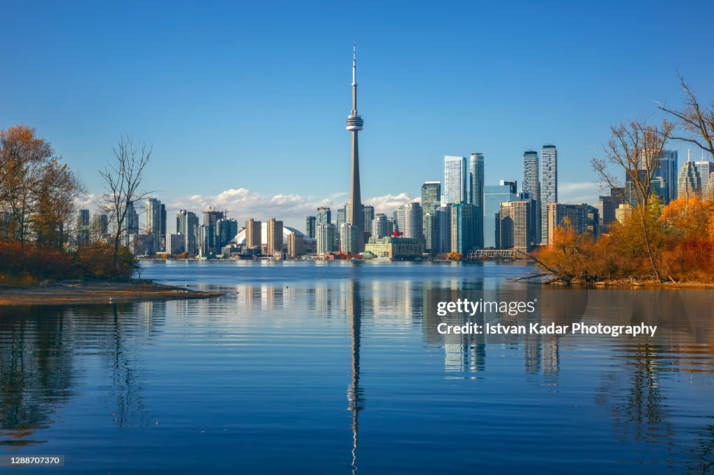 CN Tower By Lake Ontario Against Clear Sky In Toronto, Canada