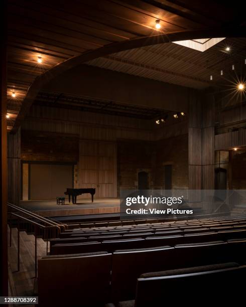 The stage with skylight open and piano. Nevill Holt Opera, Market Harborough, United Kingdom. Architect: Witherford Watson Mann Architects, 2019.