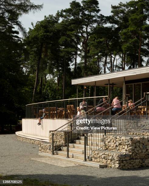 Wendover Woods Visitors Centre cafe / restaurant terrace with gabion walls. Wendover Woods Visitor Centre, Aylesbury, United Kingdom. Architect:...