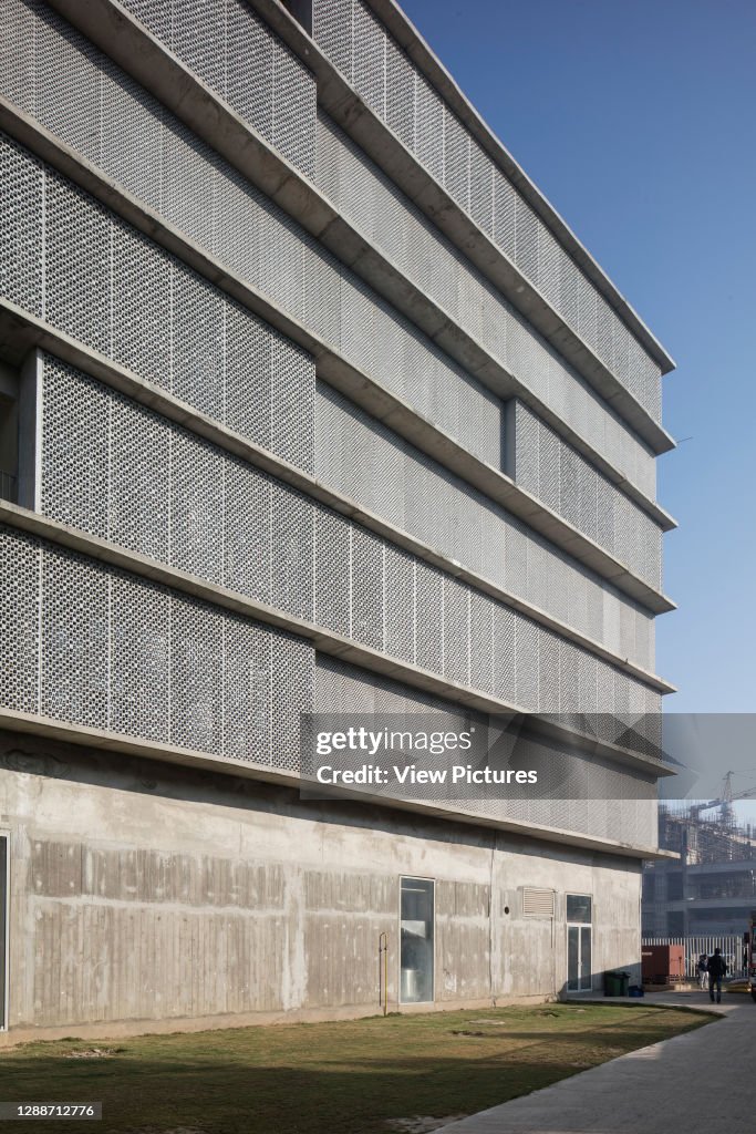 Facade perspective with perforated Jali screens. Thapar University, Patiala, India. Architect: McCullough Mulvin Architects, 2018.