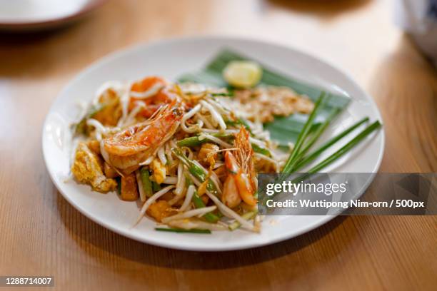 close-up of food in plate on table,thailand - pad thai stock pictures, royalty-free photos & images