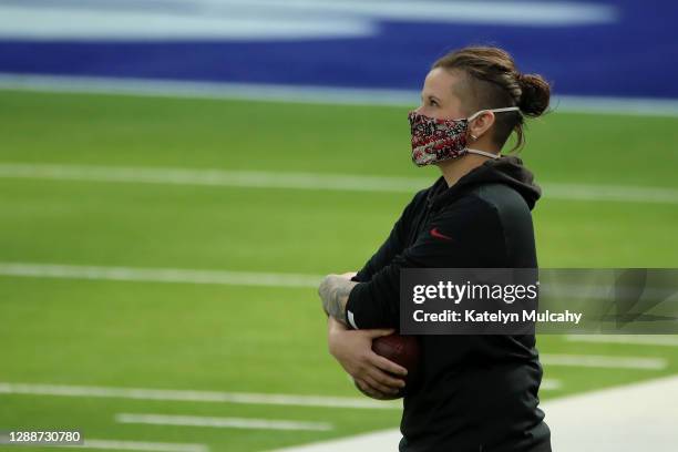 San Francisco 49ers offensive assistant Katie Sowers looks on during warm ups before the game between the San Francisco 49ers and the Los Angeles...