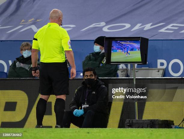 Referee Simon Hooper checks the VAR monitor before awarding a penalty to Fulham during the Premier League match between Leicester City and Fulham at...