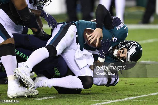 Carson Wentz of the Philadelphia Eagles is sacked by Rasheem Green of the Seattle Seahawks during the first quarter at Lincoln Financial Field on...