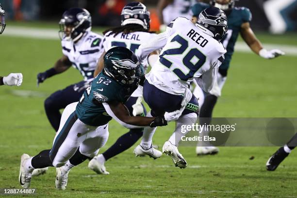 Davion Taylor of the Philadelphia Eagles makes a stop on D.J. Reed of the Seattle Seahawks on a kick return during the first half at Lincoln...