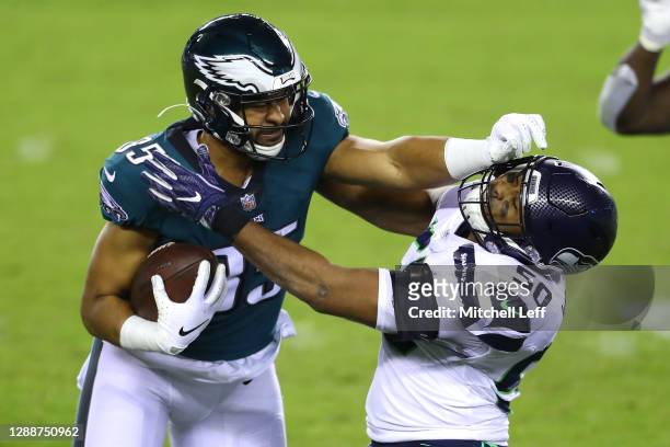 Richard Rodgers of the Philadelphia Eagles is tackled by K.J. Wright of the Seattle Seahawks during the third quarter at Lincoln Financial Field on...