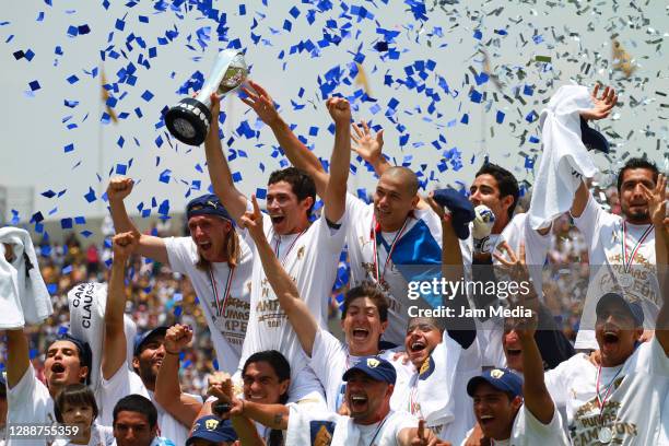 Players of Pumas celebrate championship title after defeating Morelia in a final match as part of the Clausura Tournament 2011 at Olimpico Stadium on...