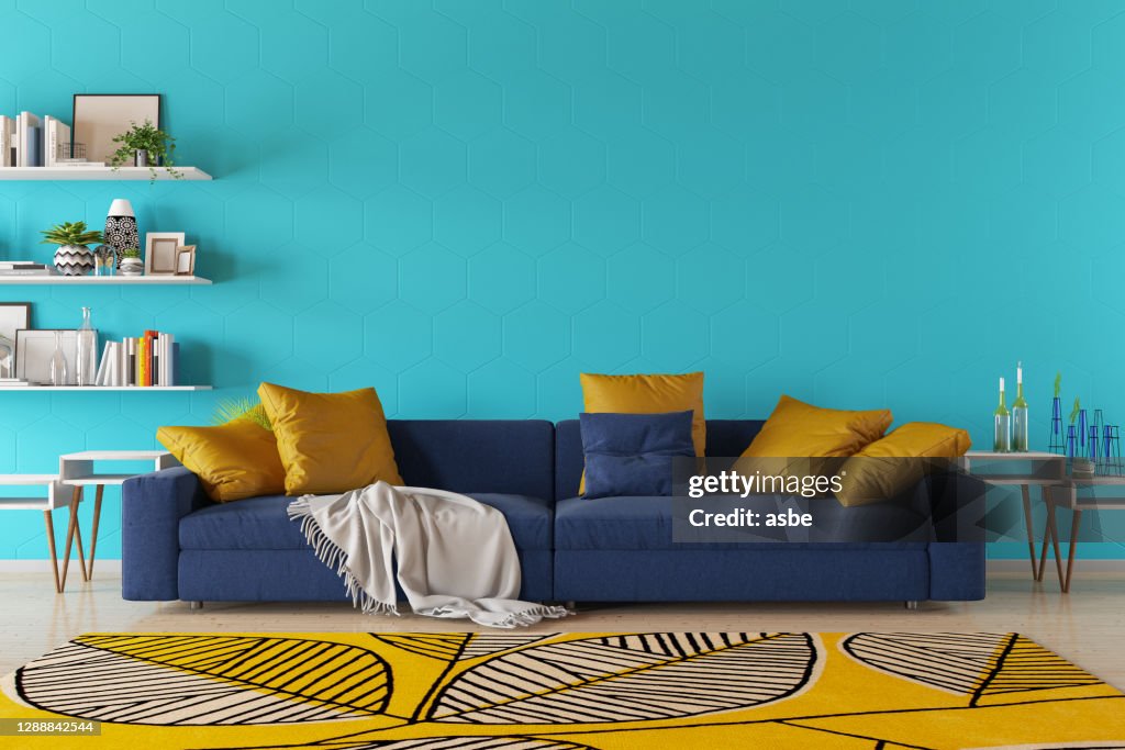 Moderna sala de estar con sofá y estantería de libros