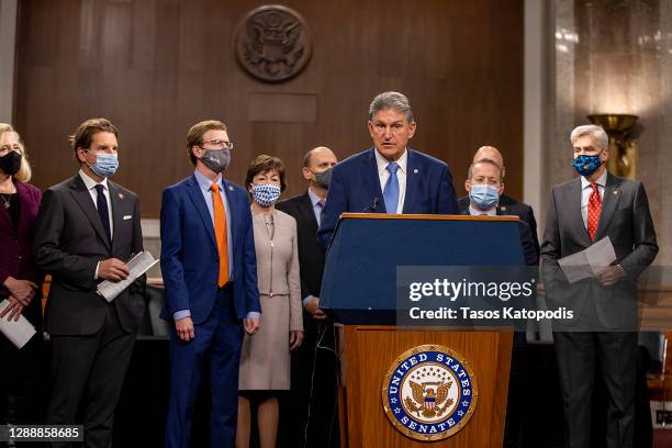 Sen. Joe Manchin speaks alongside a bipartisan group of Democrat and Republican members of Congress as they announce a proposal for a Covid-19 relief...