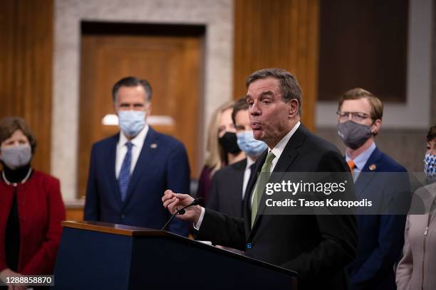 Sen. Mark Warner speaks alongside a bipartisan group of Democrat and Republican members of Congress as they announce a proposal for a Covid-19 relief...