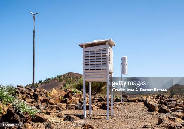 weather station measuring temperature. - weather station stock pictures, royalty-free photos & images