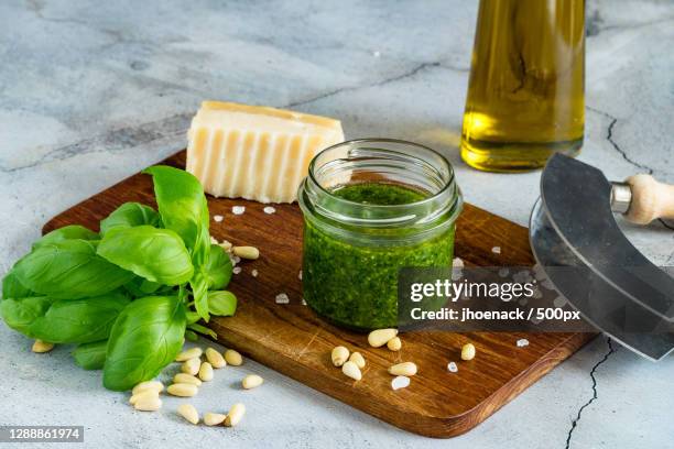 close-up of ingredients on cutting board - pesto imagens e fotografias de stock