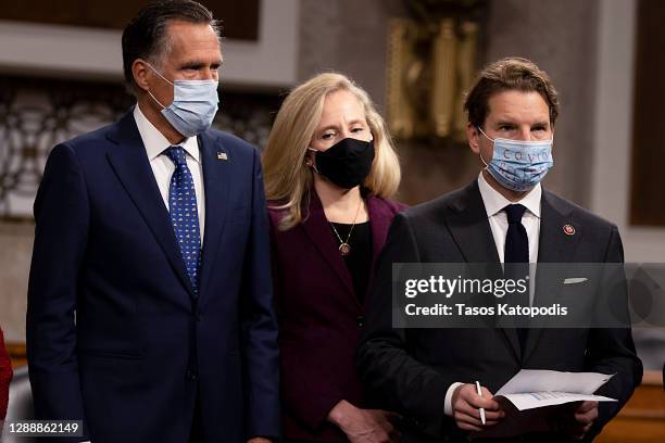 Sen. Mitt Romney , US Rep. Abigail Spanberger and US Rep. Dean Phillips alongside a bipartisan group of Democrat and Republican members of Congress...