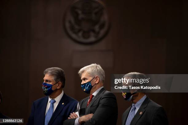 Sen. Joe Manchin , Sen. Bill Cassidy and Rep. Fred Upton stand alongside a bipartisan group of Democrat and Republican members of Congress as they...