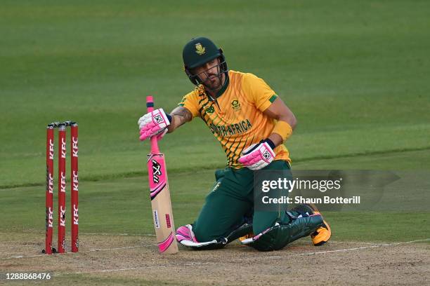 Faf du Plessis of South Africa falls over trying to avoid an accidental beamer from Chris Jordan of England during the 3rd Twenty20 International...