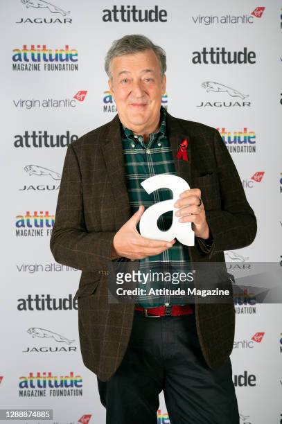 In this image released on December 1 Actor Stephen Fry poses with The Icon Award during the Virgin Atlantic Attitude Awards Powered By Jaguar...