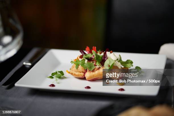close-up of food in plate on table,route de revel,durfort,france - fraicheur stock-fotos und bilder