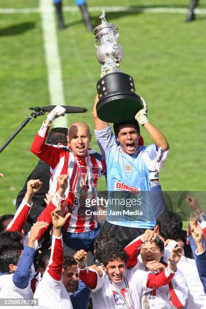 Adolfo Bautista and Oswaldo Sanchez of Chivas celebrate with the trophy during the final match of the Apertura Tournament 2006 on December 10 , 2006...
