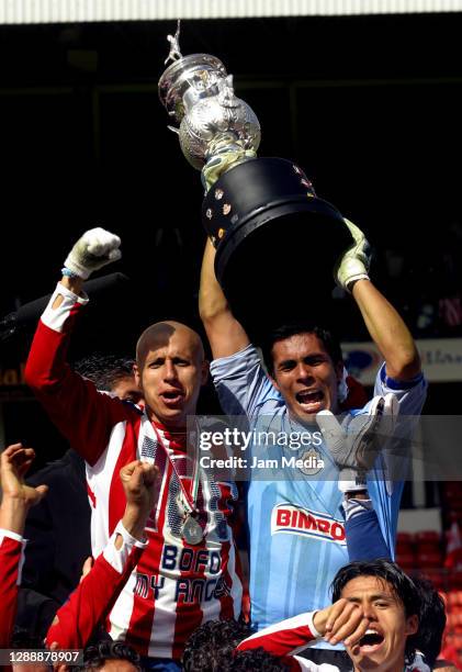 Oswaldo Sanchez and Adolfo Bautista of Chivas celebrate with the trophy during the final match of the Apertura Tournament 2006 on December 10 , 2006...