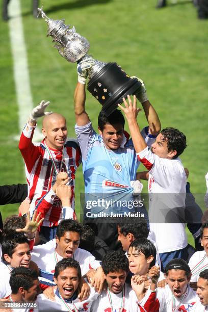 Adolfo Bautista, Oswaldo Sanchez and Omar Bravo of Chivas celebrate with the trophy during the final match of the Apertura Tournament 2006 on...