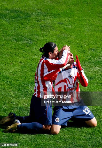 Adolfo Bautista of Chivas celebrates with Alberto Medina after scoring the second goal during the final match of the Apertura Tournament 2006 on...