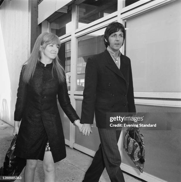 Musician Paul McCartney of the Beatles with his partner, actress Jane Asher at Heathrow Airport, London, UK, 25th March 1968. They are returning from...