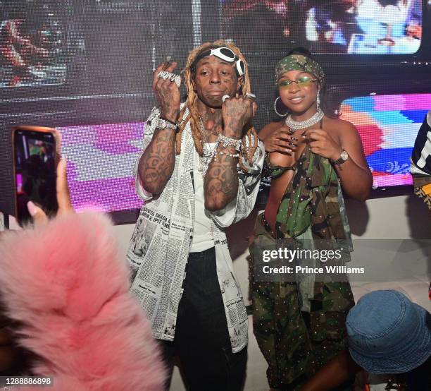 Lil Wayne and Reginae Carter attend Reginae Carter's 22nd Hot Girl Birthday at Republic Lounge on November 29, 2020 in Atlanta, Georgia.