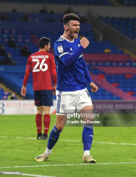 Cardiff striker Kieffer Moore celebrates after scoring the opening goal during the Sky Bet Championship match between Cardiff City and Huddersfield...