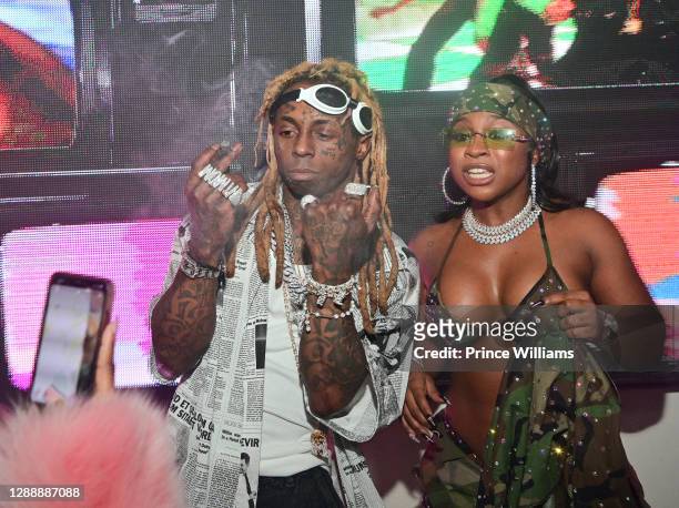 Lil Wayne and Reginae Carter attend Reginae Carter's 22nd Hot Girl Birthday at Republic Lounge on November 29, 2020 in Atlanta, Georgia.