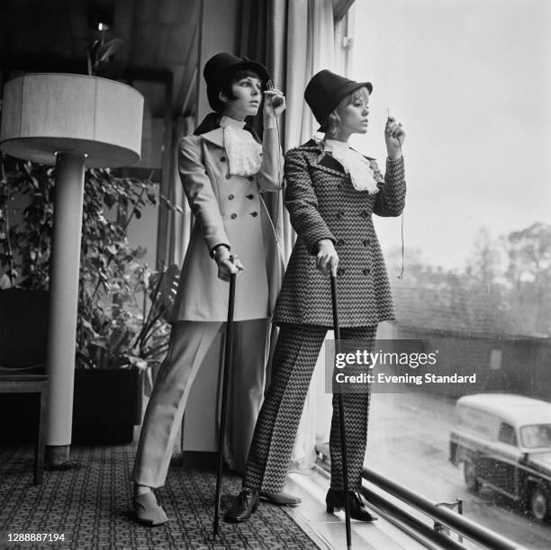 Models in trouser suits with a period twist, UK, 4th May 1967.