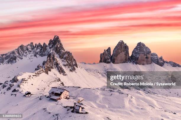 monte paterno and tre cime di lavaredo at sunset, dolomites, south tyrol - cielo romantico foto e immagini stock