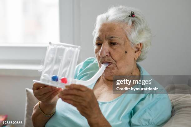 old woman with breathing problems at home - chronic obstructive pulmonary disease stock pictures, royalty-free photos & images