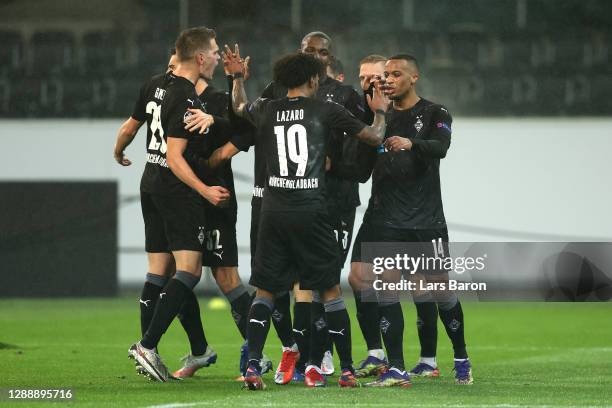 Alassane Plea of Borussia Moenchengladbach celebrates with Valentino Lazaro, Matthias Ginter and Tony Jantschke after scoring their team's first goal...