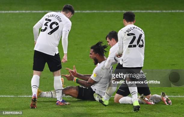 Colin Kazim-Richards of Derby County celebrates with teammates Jack Stretton, Jason Knight and Lee Buchanan after scoring his team's first goal...