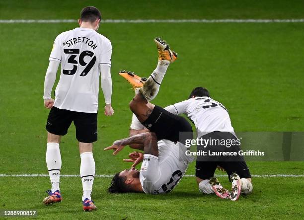 Colin Kazim-Richards of Derby County celebrates with teammates Jack Stretton and Jason Knight after scoring his team's first goal during the Sky Bet...