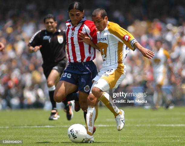 Juan Francisco Palencia of Chivas and Ailton Da Silva of Pumas fight for the ball during the final match Pumas against Chivas of the Clausura...