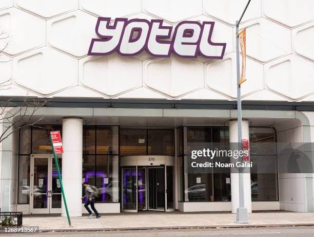 Person wears a face mask outside Yotel hotel as the city continues the re-opening efforts following restrictions imposed to slow the spread of...