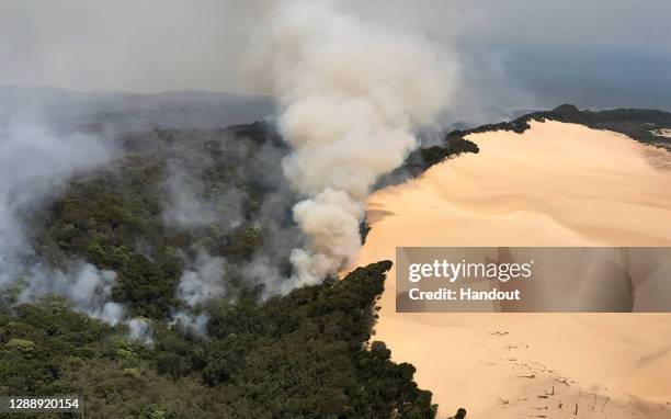 Best quality image available.) In this handout image provided by Queensland Fire and Emergency Services , bushfires continue to burn on November 30,...