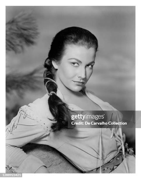 Actress Mara Corday plays the Native American ‘Paca’ in a publicity shot from the movie 'Raw Edge' United States.