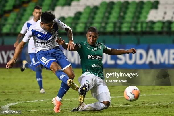 Cristian Tarragona of Velez shoots to score the fourth goal of his team during a round of sixteen second leg match between Deportivo Cali and Velez...