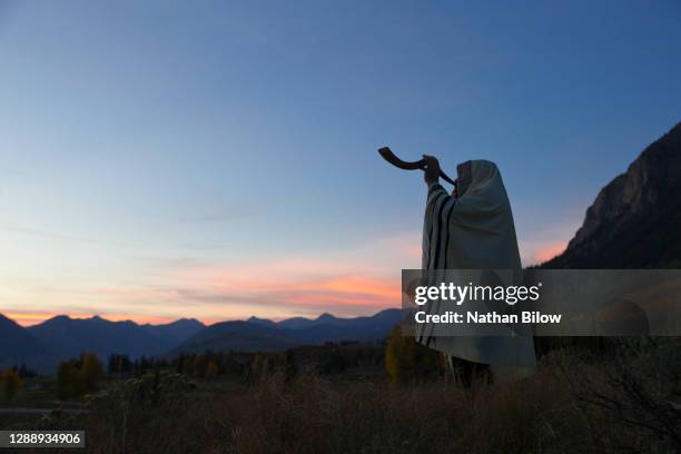 jewish cantor blowing shofar - shofar stock pictures, royalty-free photos & images