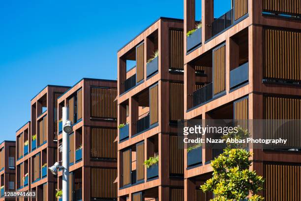 building apartments. - modern housing development stock pictures, royalty-free photos & images