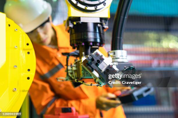 the robot for metal handing sheet metal in forming process .modern factory for industrial manufacturing process with robot officer control. - technology revolution stock pictures, royalty-free photos & images