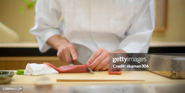 close up hand of japanese sushi chef cooking traditional japanese kaiseki food for customer - 料亭 ストックフォトと画像