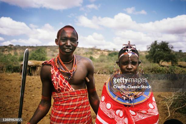 1990s Masai Couple In Traditional Dress Looking At Camera Kenya Africa